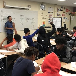 A class full of students sitting at desks