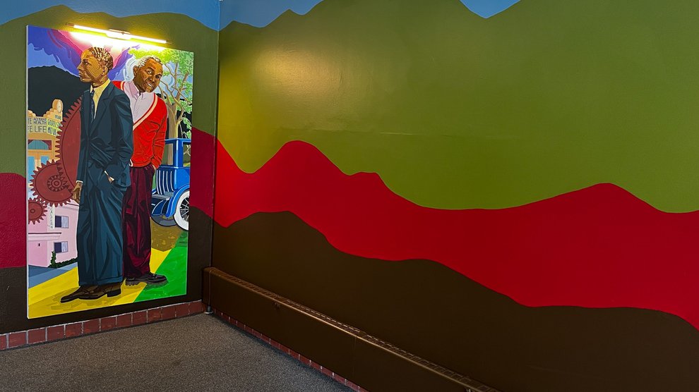 The Venerable portrait and adjoining mural in the lobby of Venerable House.