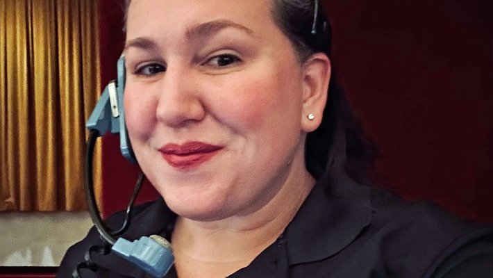 Veronica Mullins Bowers wearing headset backstage