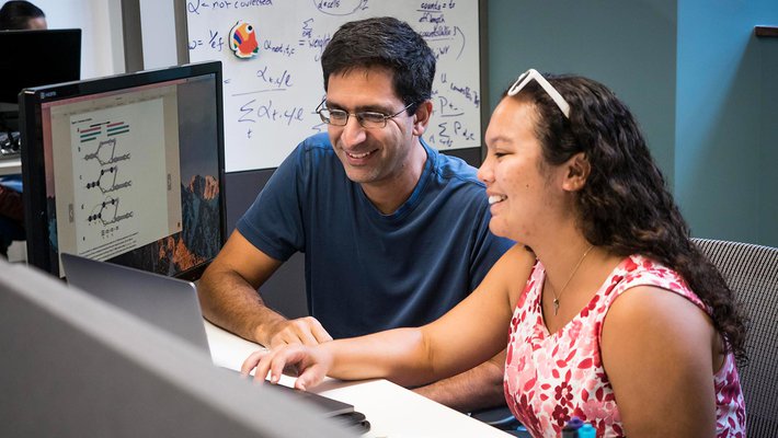 Graduate student Rebekah Loving with Bren Professor of Computational Biology and Computing and Mathematical Sciences Lior Pachter