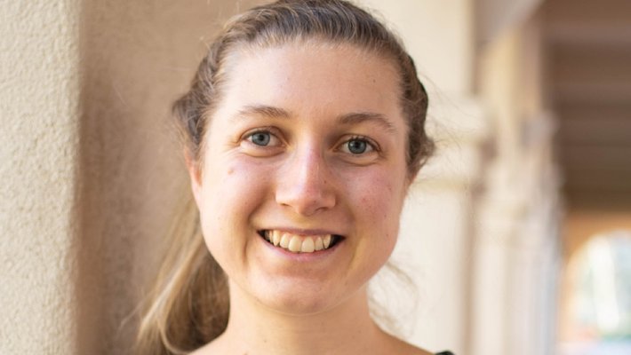 A portrait of Sophie Walton smiling