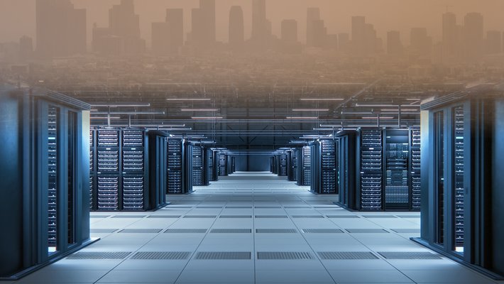 A photo of a data center at the bottom of the screen bleeds into a smoggy image of Los Angeles at the top.