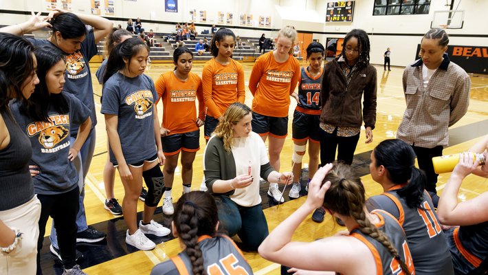 Women's Basketball Coach Annie Tarakchian with her team