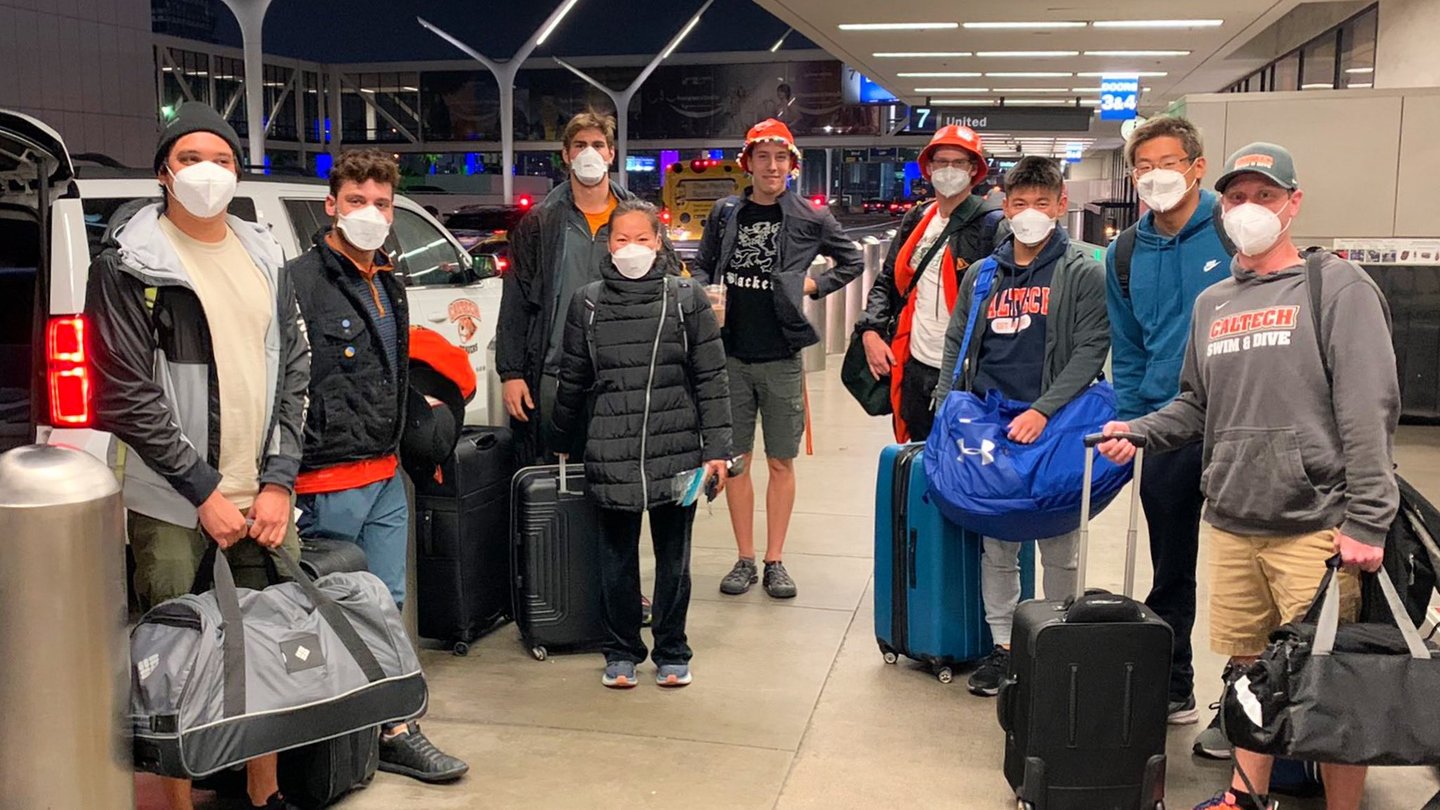 Caltech Swim and Dive team wearing masks at airport