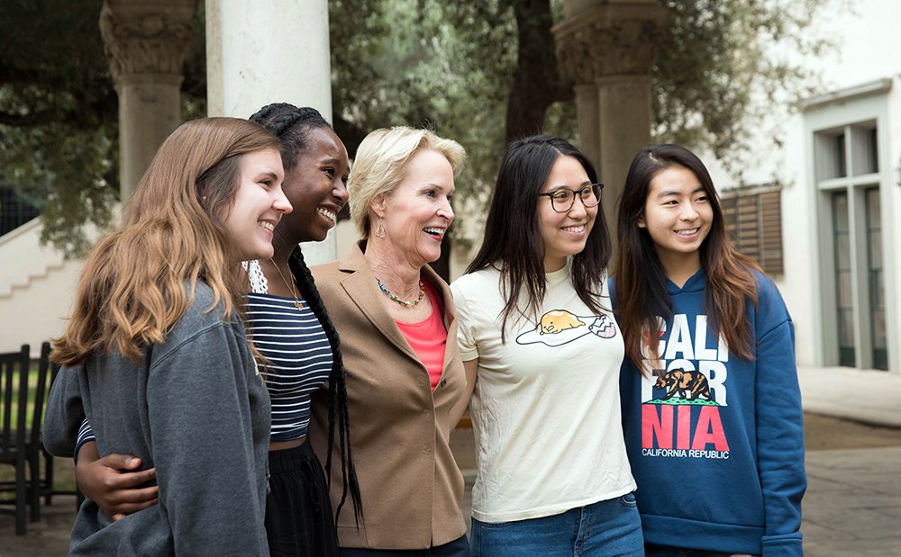 photo of Frances Arnold with students after the ceremony.