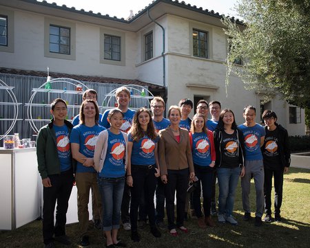 photo of Frances Arnold and members of her research team gathered after the festivities