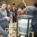 students prepare to test their balsa wood tower