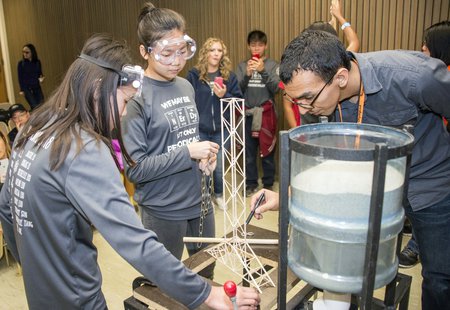 students prepare to test their balsa wood tower