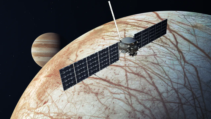 Jupiter in the background, Europa in the foreground, and rectangular shape of Clipper at front