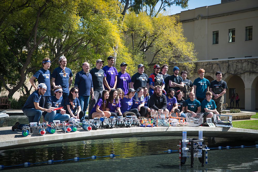 The entire 2019 ME72 class gathers on the bridge over Millikan Pond for a group photo