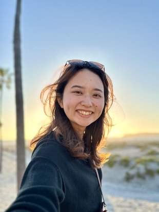 Portrait of Honami Tanaka in front on a sunset.