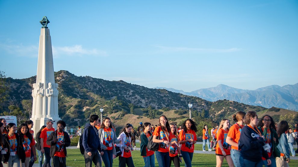 A group of students with mountains in the background