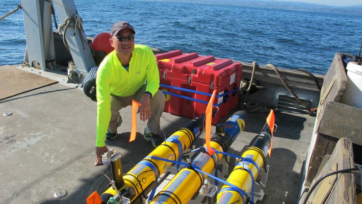 photo of Steve Chien with drones
