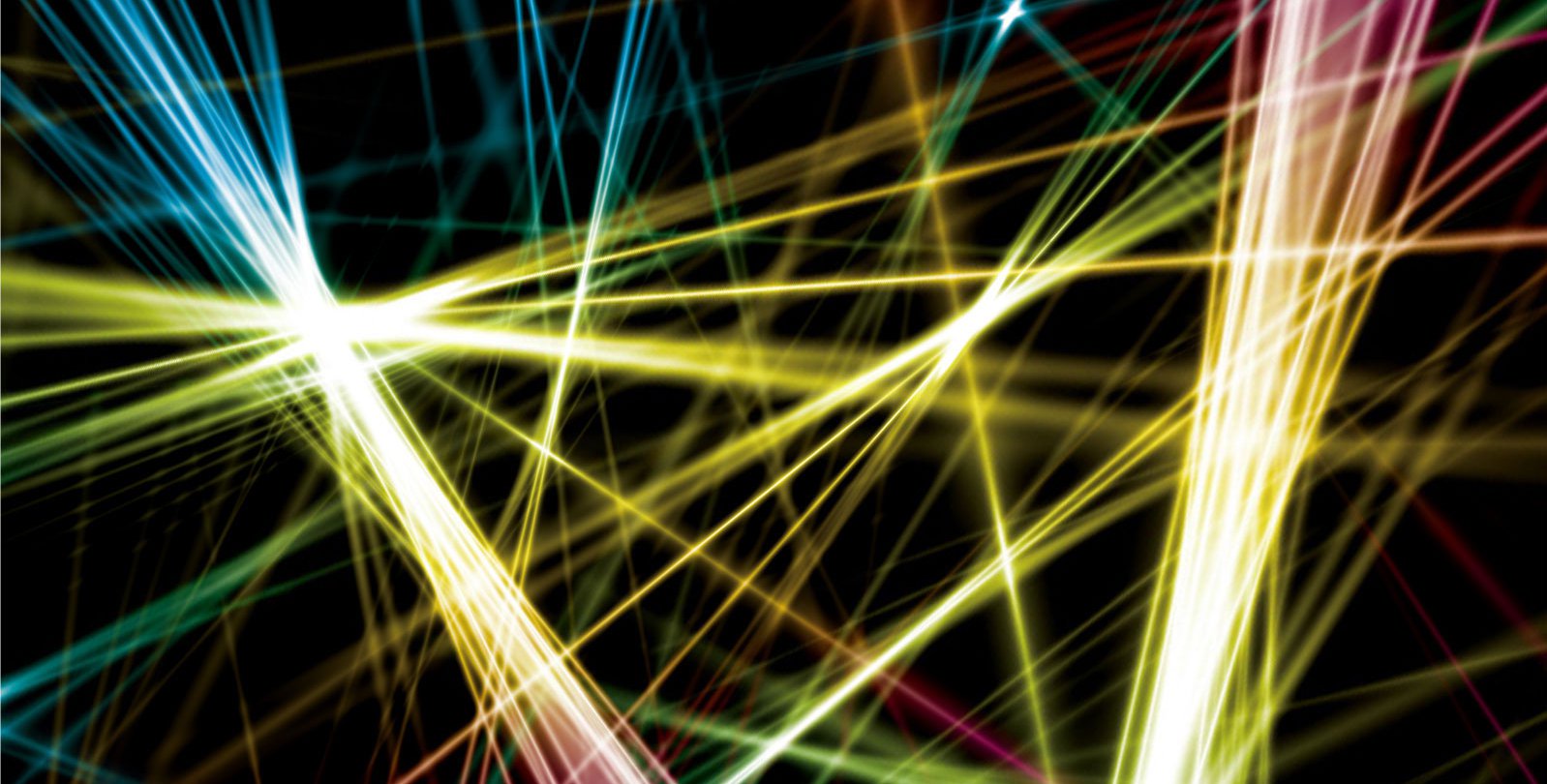 An artist's rendition of multi-colored laser beams chaotically arranged in front of a black background.