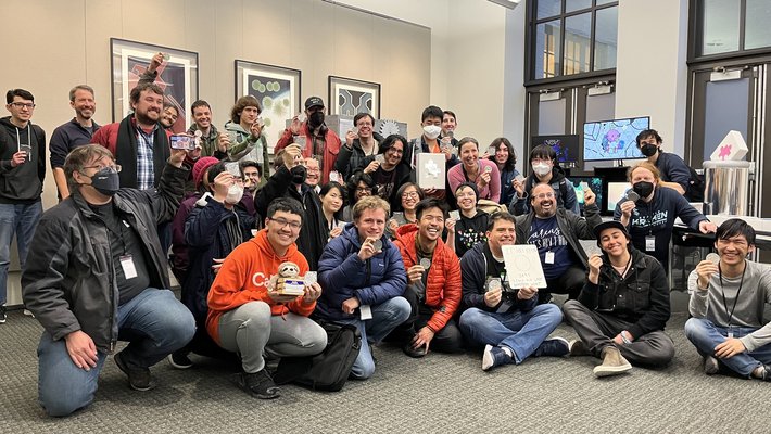 A room full of students holding up their awards