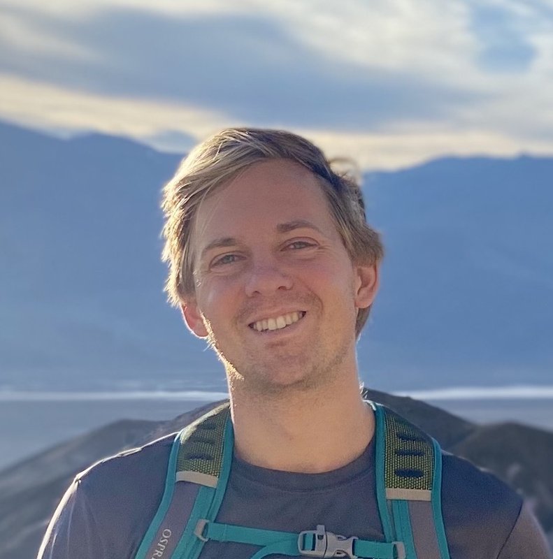 Thomas Schuster wearing a backpack.