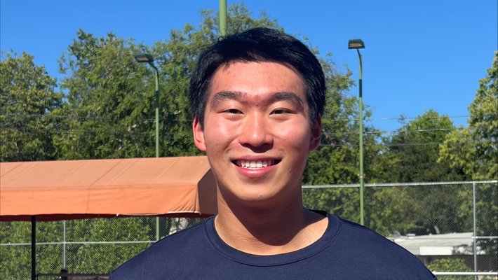 Simon Hu on a tennis court