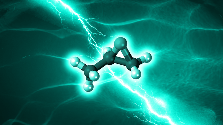 An artist's concept of propylene oxide being created. A ball-and-stick molecule model is seen in front of a watery background with electricity.