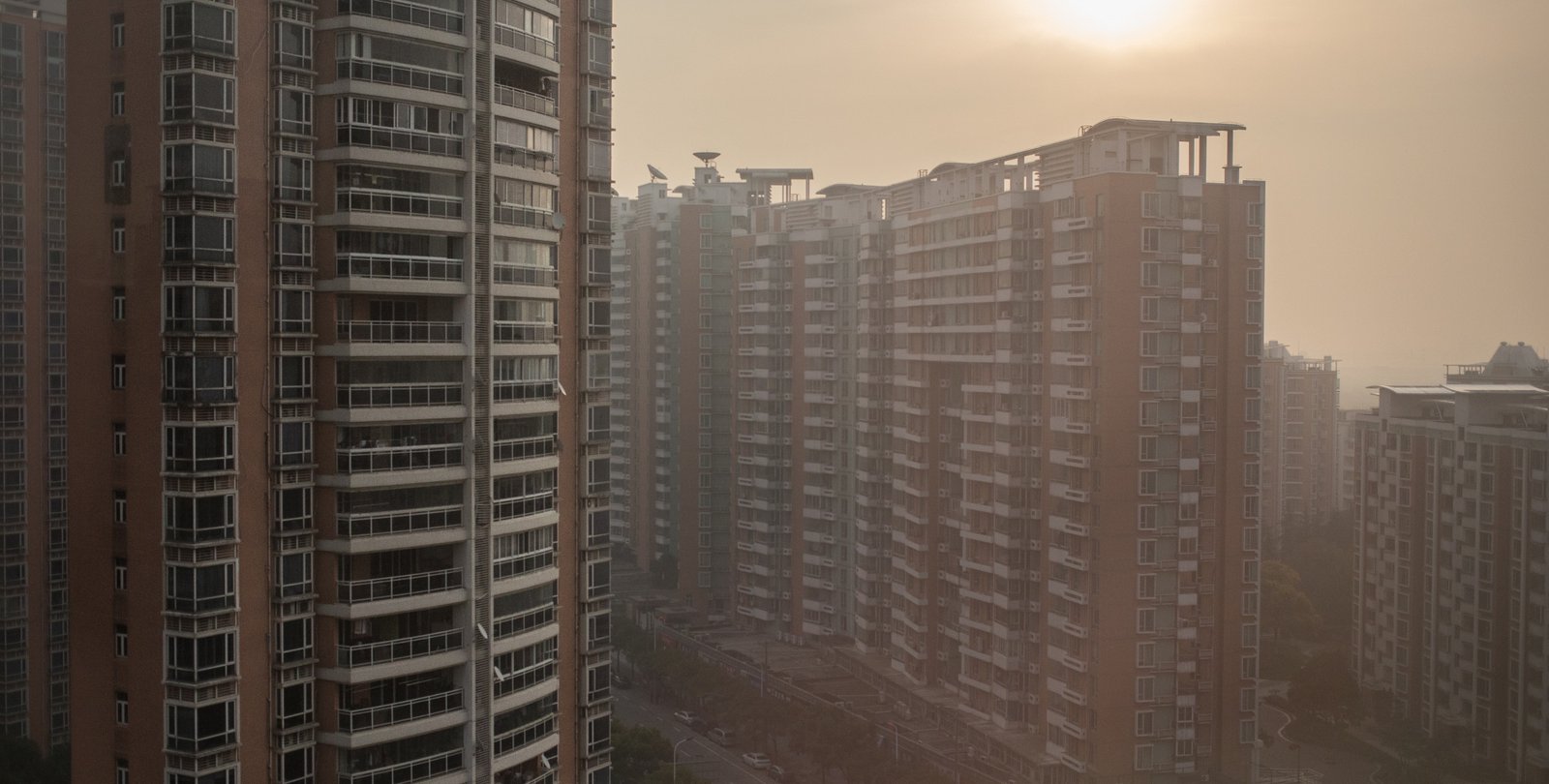 High-rise apartment buildings are shrouded by air pollution in Shanghai.