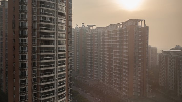 High-rise apartment buildings are shrouded by air pollution in Shanghai.