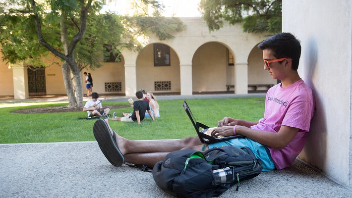 student sitting outside at Caltech