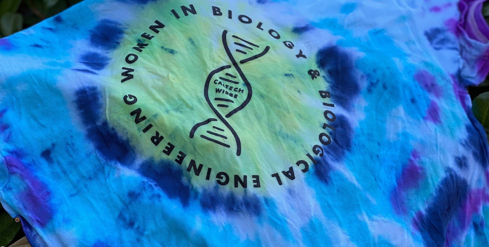a blue tie dye t-shirt with the logo for women in BBE